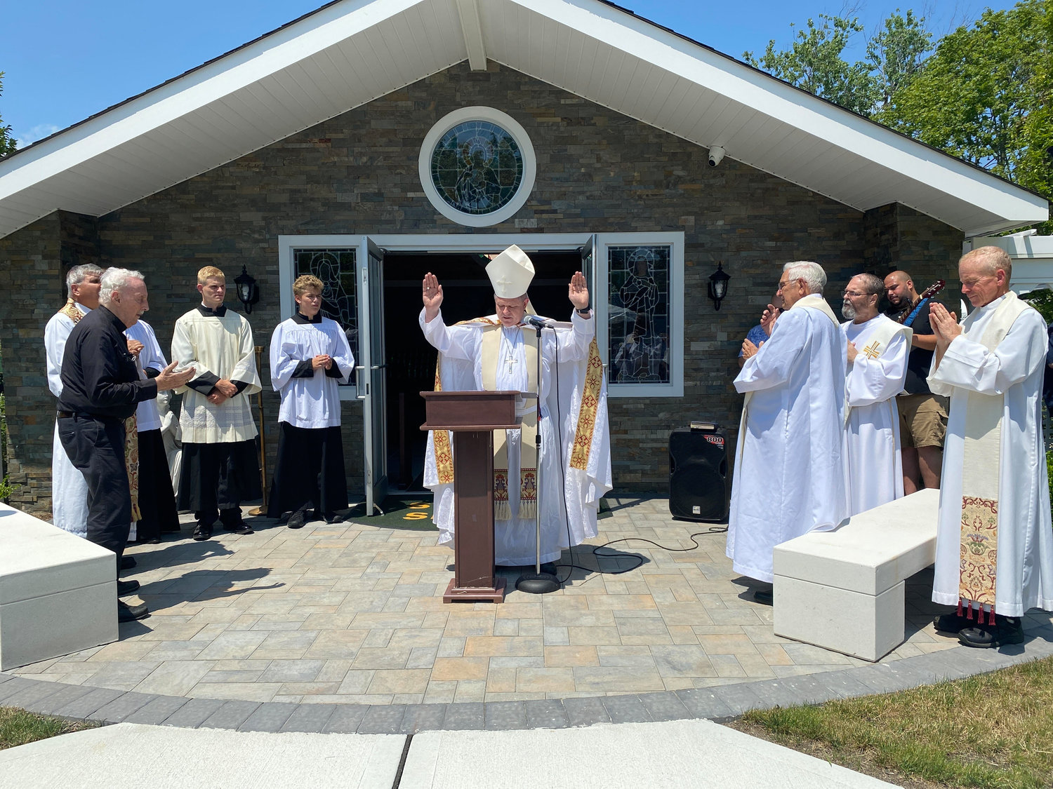 Outside the shrine, a dedication ceremony was performed by Bishop Robert Coyle.